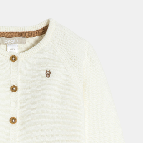 جيليه محبوك من التريكو باللون الأبيض لحديثي الولادة من الجنسين.